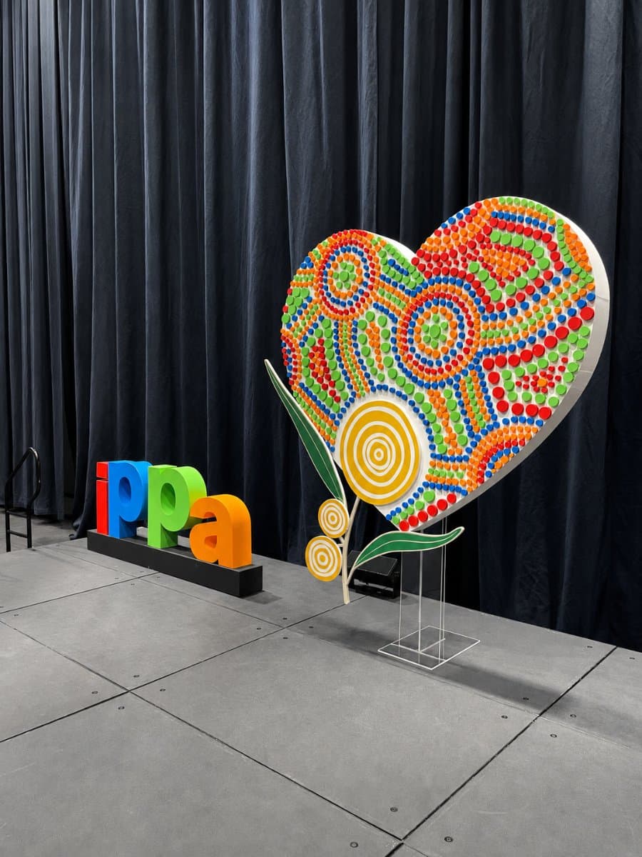 Printed and cut shaped display on a stand