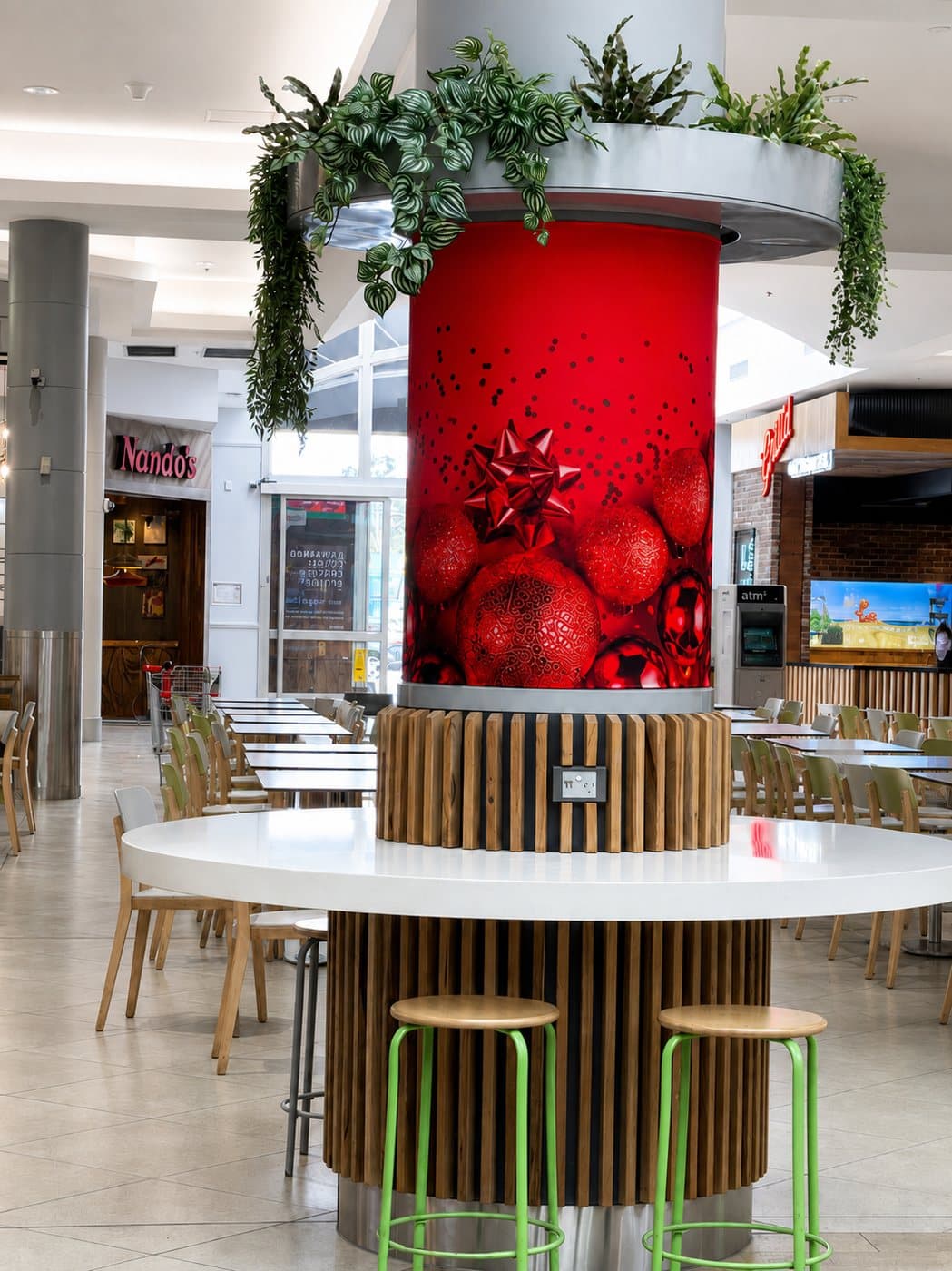 Pillar wraps installed in a shopping centre