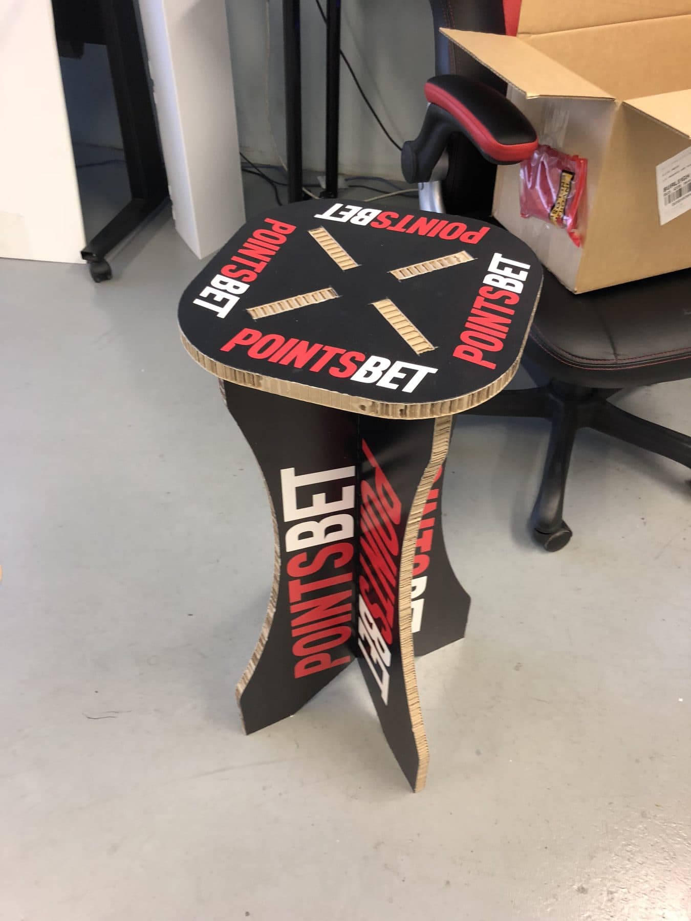 Branded side table cut and slot assembled from printed corrugated board