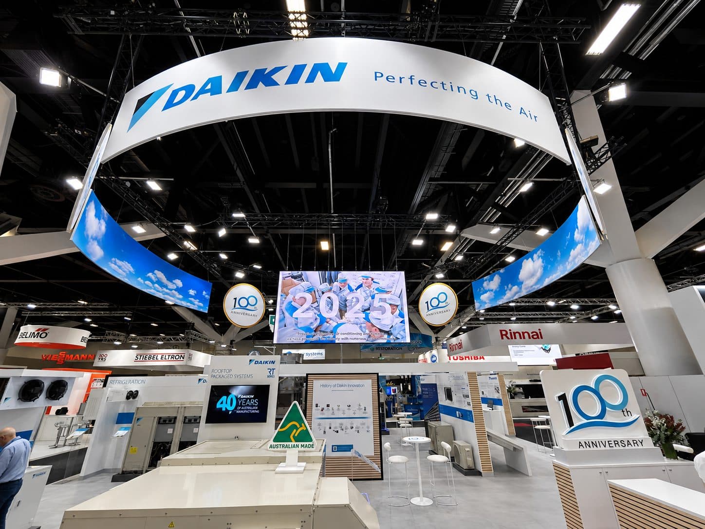Trade show stand with printed arch and walls