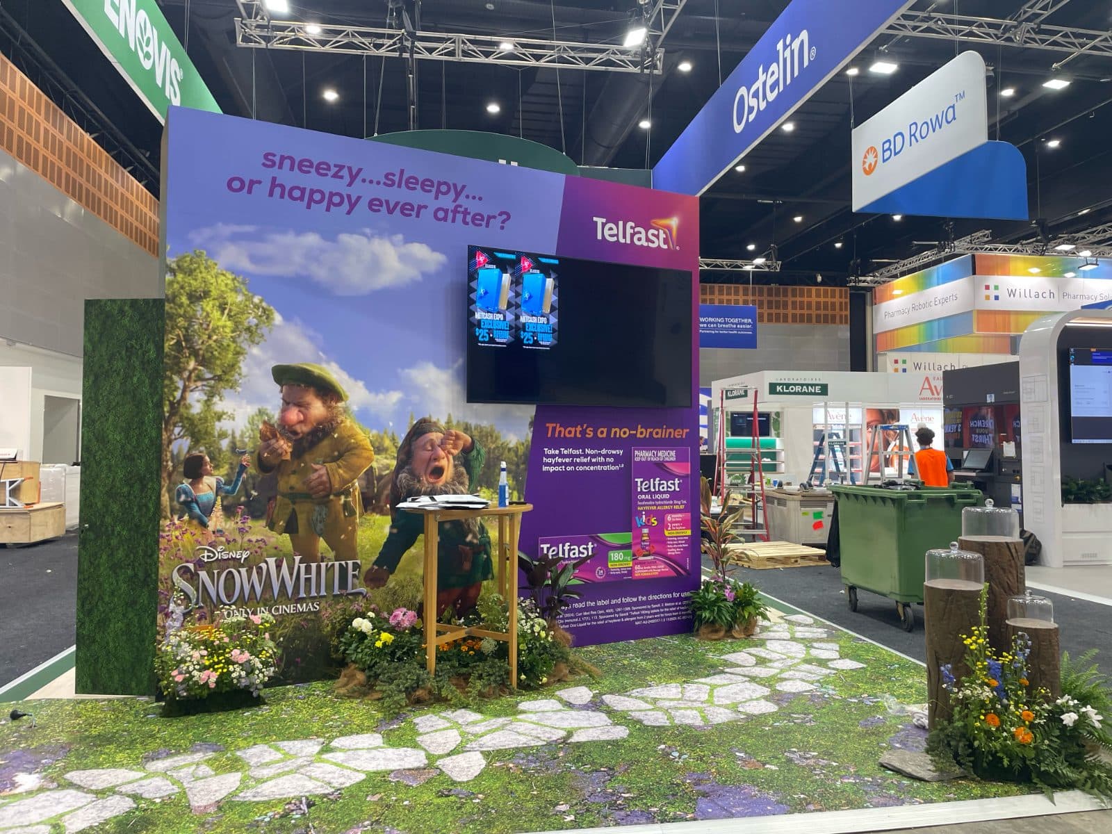 Exhibition stand with printed walls, dressed floor and cut-out characters