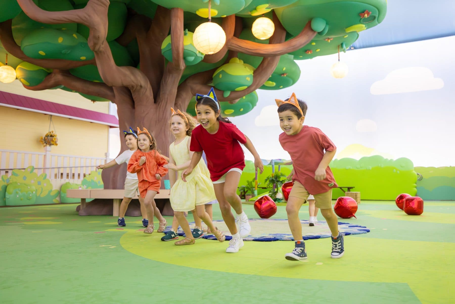 Themed indoor play area with printed scenic walls