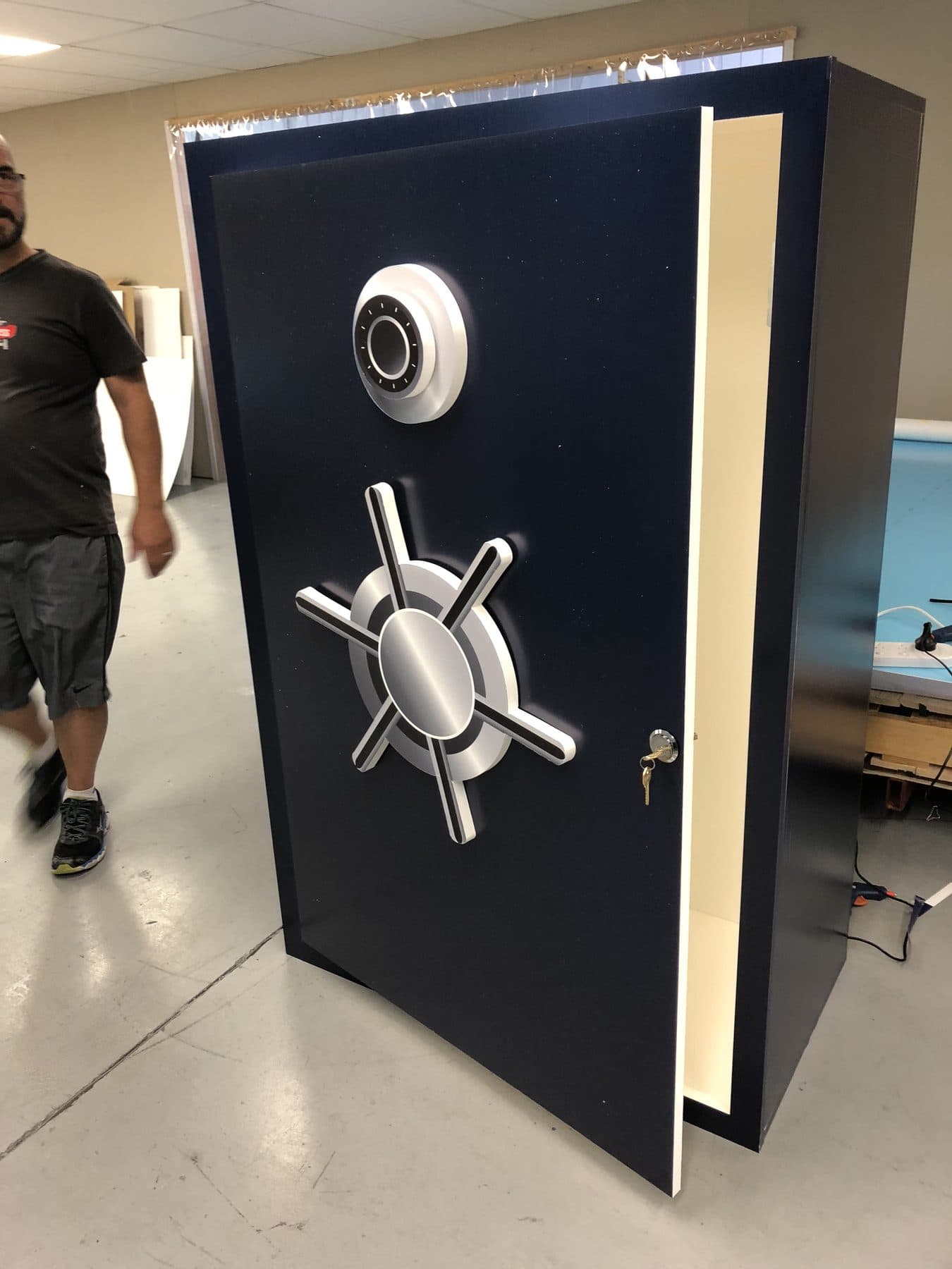 Oversized vault door prop built from printed rigid panels with a working hinged door