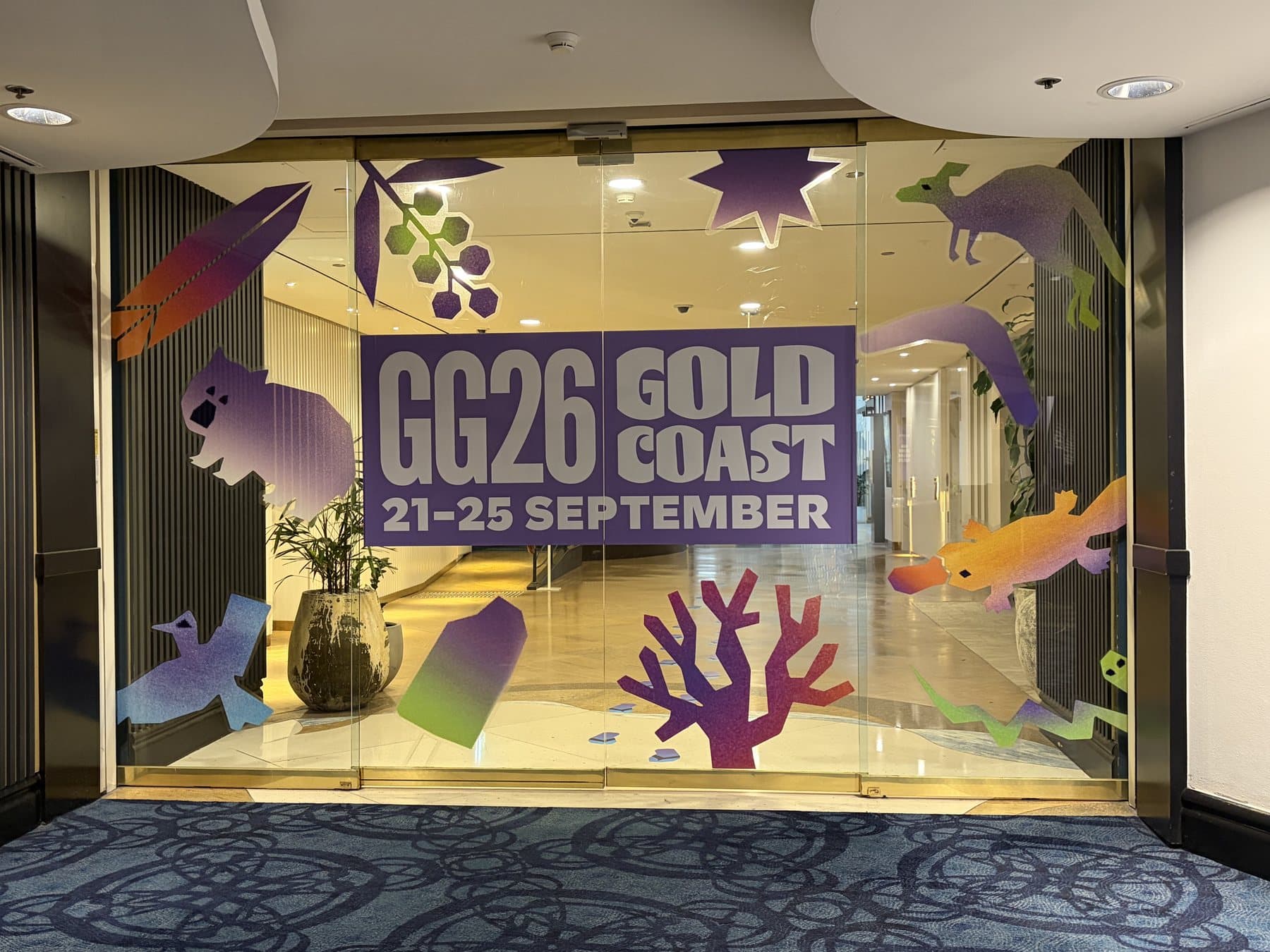 Cut graphics applied to glass entry doors at a conference venue