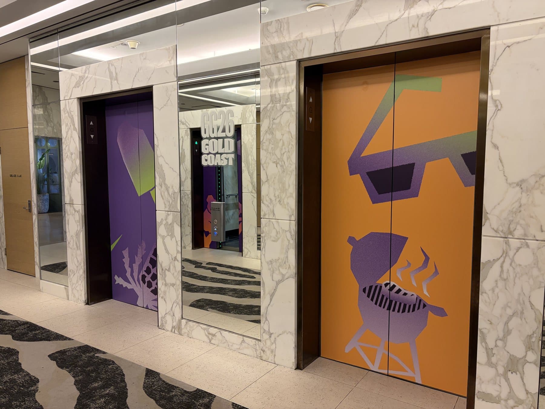 Printed wraps on a row of hotel lift doors